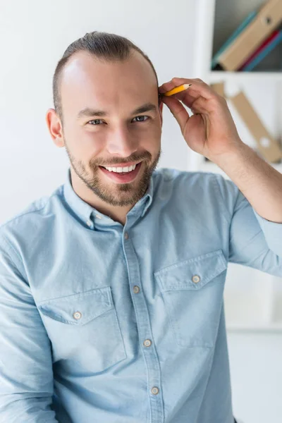 Man with pencil behind ear — Stock Photo