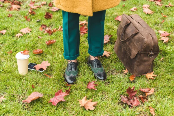 Fashionable woman on lawn — Stock Photo