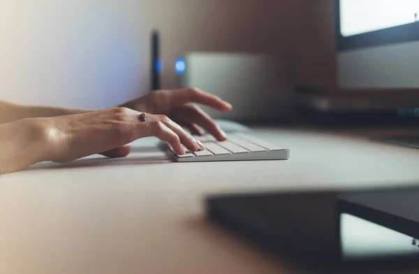 female hands working on computer