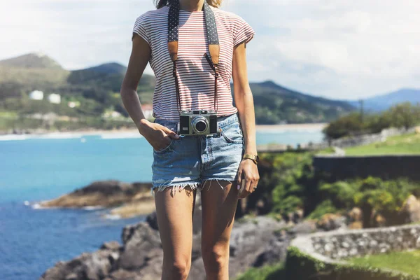 Tourist photographer with vintage photo camera
