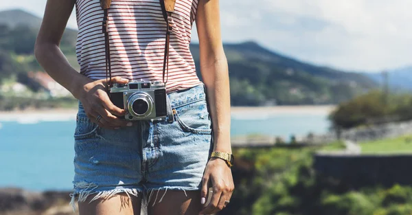 Tourist photographer with vintage photo camera