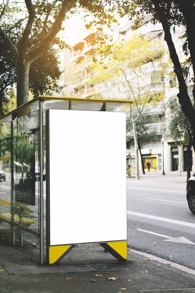 Blank advertising light box on bus stop, mockup of empty ad billboard on sun day bus station, template banner on background city street for poster or sign in Barcelona, afisha board and taxi car