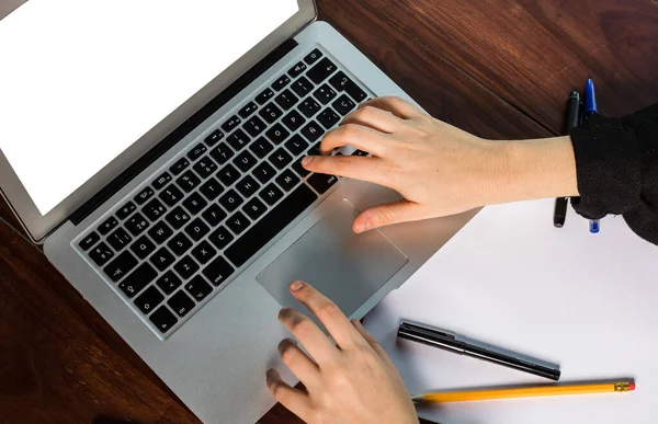 hands using the keyboard of a laptop