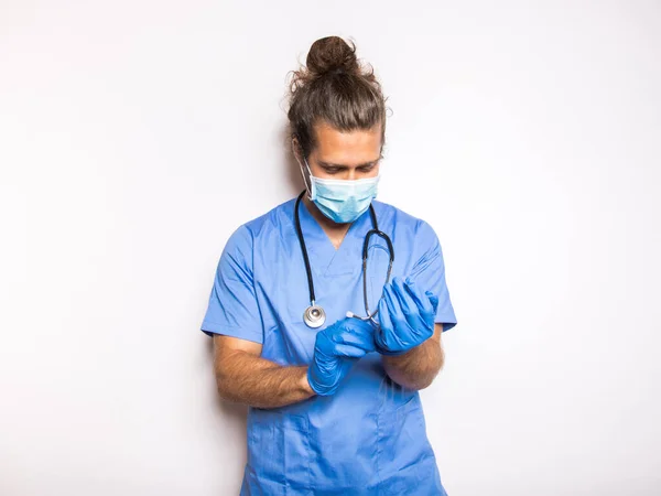 doctor with mask and gloves in a white background