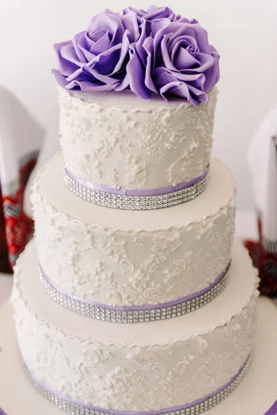 Wedding cake with purple flowers, wedding cake