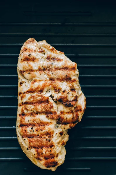 Grilled chicken steak on the grill