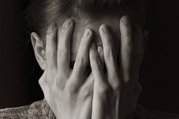 A young guy with a fashionable hairstyle poses for the camera