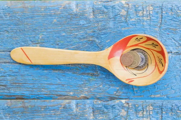 Wooden Spoon Coins Edge Wooden Table Blue — Stock Photo, Image