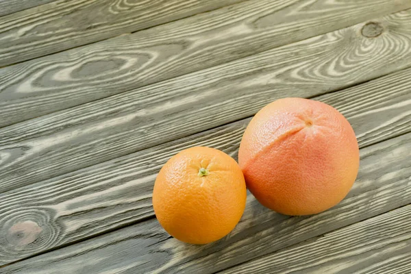 Still life of citrus fruits. Grapefruit on a decorative backgrou — Stock Photo, Image