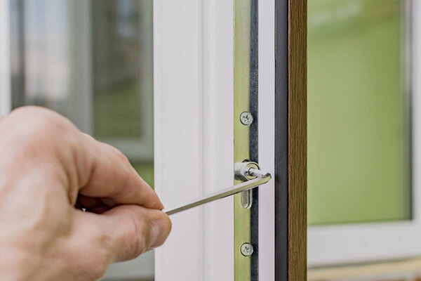 Fragment of a plastic door hinge during installation