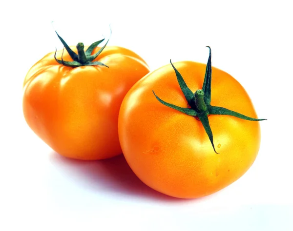 Два желтых помидора — стоковое фото