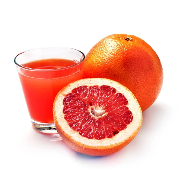 Grapefruktjuice i ett glas av frukt — Stockfoto