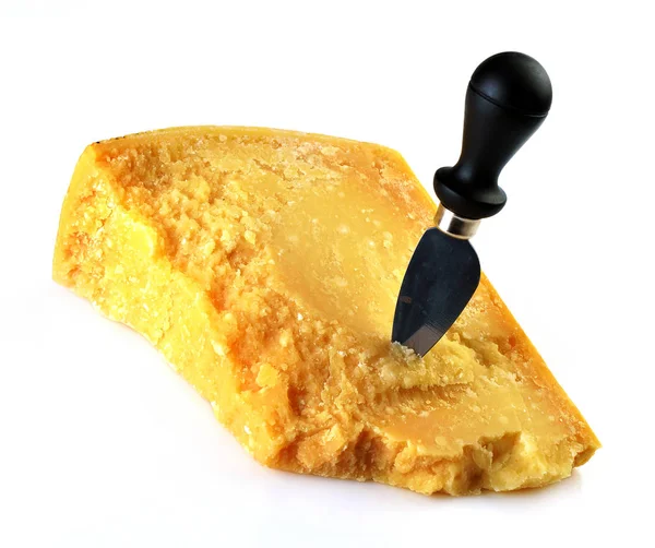 Piece of Italian parmesan cheese with a knife — Stock Photo, Image