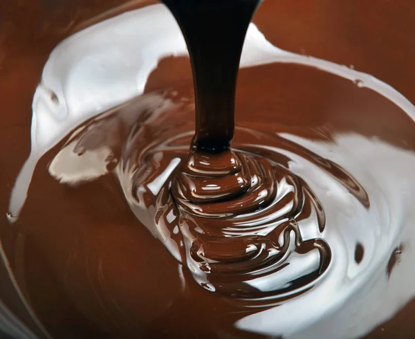 Lots of chocolate falling from above — Stock Photo, Image