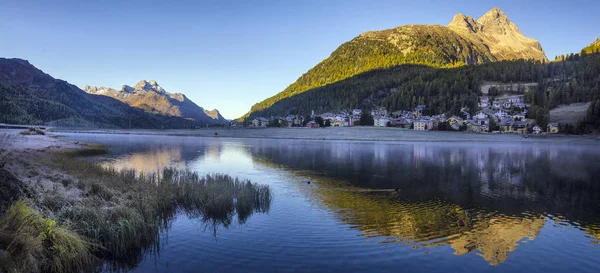 Mountain lake panorama with mountains reflection. Idyllic look.