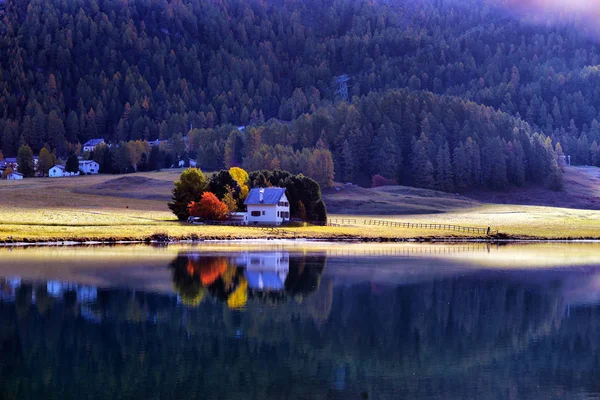 Mountain lake panorama with mountains reflection. Idyllic look.