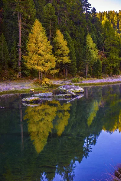 Mountain lake panorama with mountains reflection. Idyllic look.