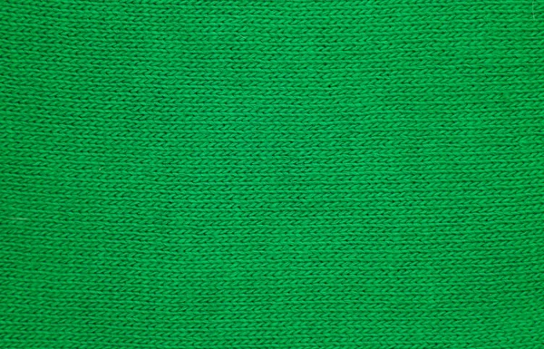 Green abstract texture, background. Green knitted texture for design lose up