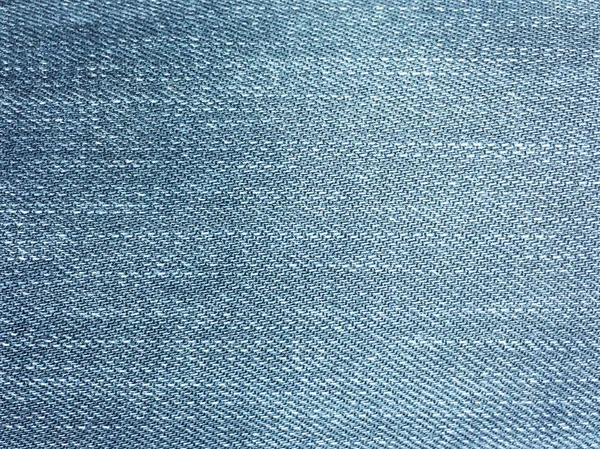 Tekstil gaya lama. Latar belakang desain Denim. Industri kain yang indah. Tekstur asli denim pola. Celana jeans biru tekstil denim. Bahan jeans vintage super. Makro Denim . — Stok Foto