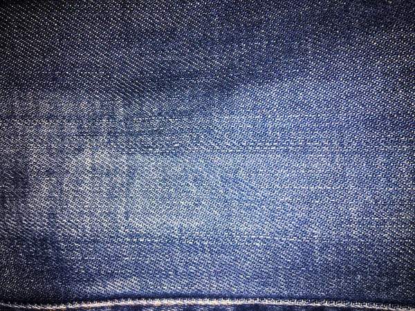 Tekstil gaya lama. Latar belakang desain Denim. Industri kain yang indah. Tekstur asli denim pola. Celana jeans biru tekstil denim. Bahan jeans vintage super. Makro Denim . — Stok Foto