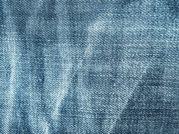 Tekstil gaya lama. Latar belakang desain Denim. Industri kain yang indah. Tekstur asli denim pola. Celana jeans biru tekstil denim. Bahan jeans vintage super. Makro Denim . — Stok Foto