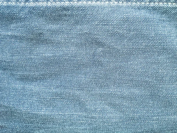 Tekstil gaya lama. Latar belakang desain Denim. Industri kain yang indah. Tekstur asli denim pola. Celana jeans biru tekstil denim. Bahan jeans vintage super. Makro Denim . — Stok Foto