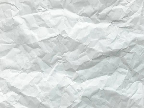 Weißes Blatt Papier gefaltet. zerkleinertes und gefaltetes weißes Blatt Papier. Zettelchen. Faltenpapier — Stockfoto