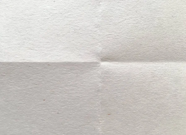 White sheet of paper folded. Crushed and folded white sheet of paper. Note paper. Wrinkled paper — Stock Photo, Image
