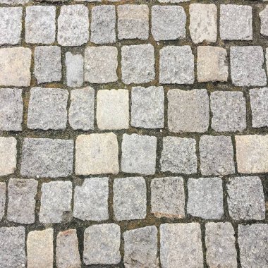 Taş kaldırım dokusu. Granit cobblestoned kaldırım arka plan. Arka plan eski kaldırım taşı kaldırım yakın çekim. Sorunsuz kaldırım doku