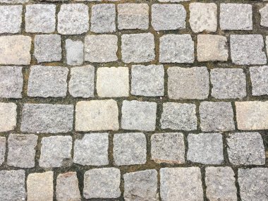 Taş kaldırım dokusu. Granit cobblestoned kaldırım arka plan. Arka plan eski kaldırım taşı kaldırım yakın çekim. Sorunsuz kaldırım doku
