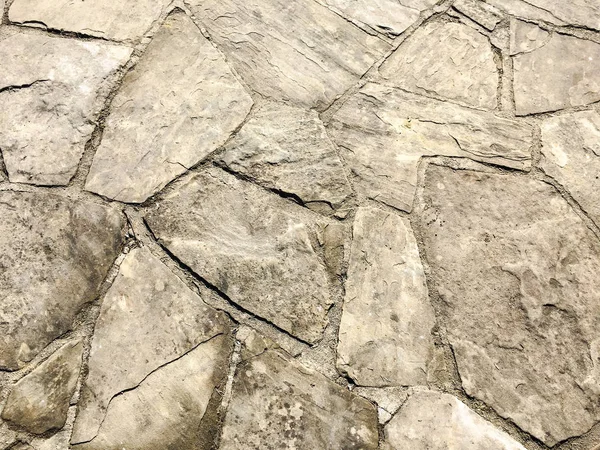 石舗装のテクスチャです。花崗岩の石畳舗装の背景。古い石畳舗装のクローズ アップの抽象的な背景は。シームレスな舗装テクスチャー. — ストック写真