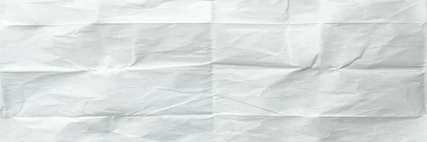 White sheet of paper folded. Crushed and folded white sheet of paper. Note paper. Wrinkled paper