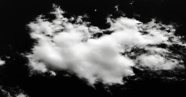 Isolated white clouds on black sky background.