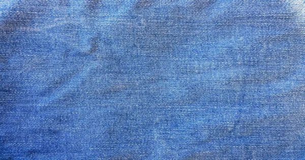 Latar belakang biru, latar belakang jeans denim. Tekstur Jeans, kain . — Stok Foto