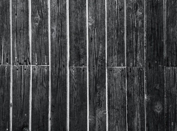 Superficie in legno tenero scuro come sfondo, struttura in legno. Pannelli di legno . — Foto Stock