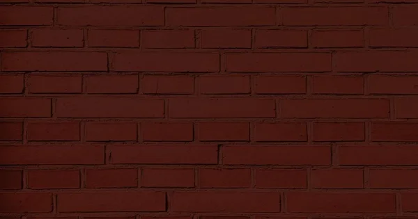 Vörös téglafal, sötét háttér előtt a design. Festett vörös téglafal része. Üres. — Stock Fotó