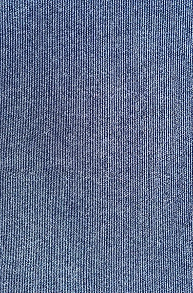 ジーンズ デニム生地パンツ テクスチャ、青い背景. — ストック写真