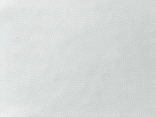 Primer plano de textura de cuero blanco sin costuras. Fondo con textura de cuero blanco. Textura de cuero beige, piel de vaca blanca para fondo . — Foto de Stock