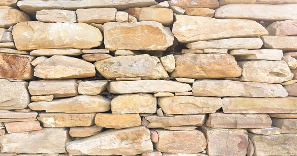 Stacked stone wall background horizontal. White stone tile texture brick wall background.