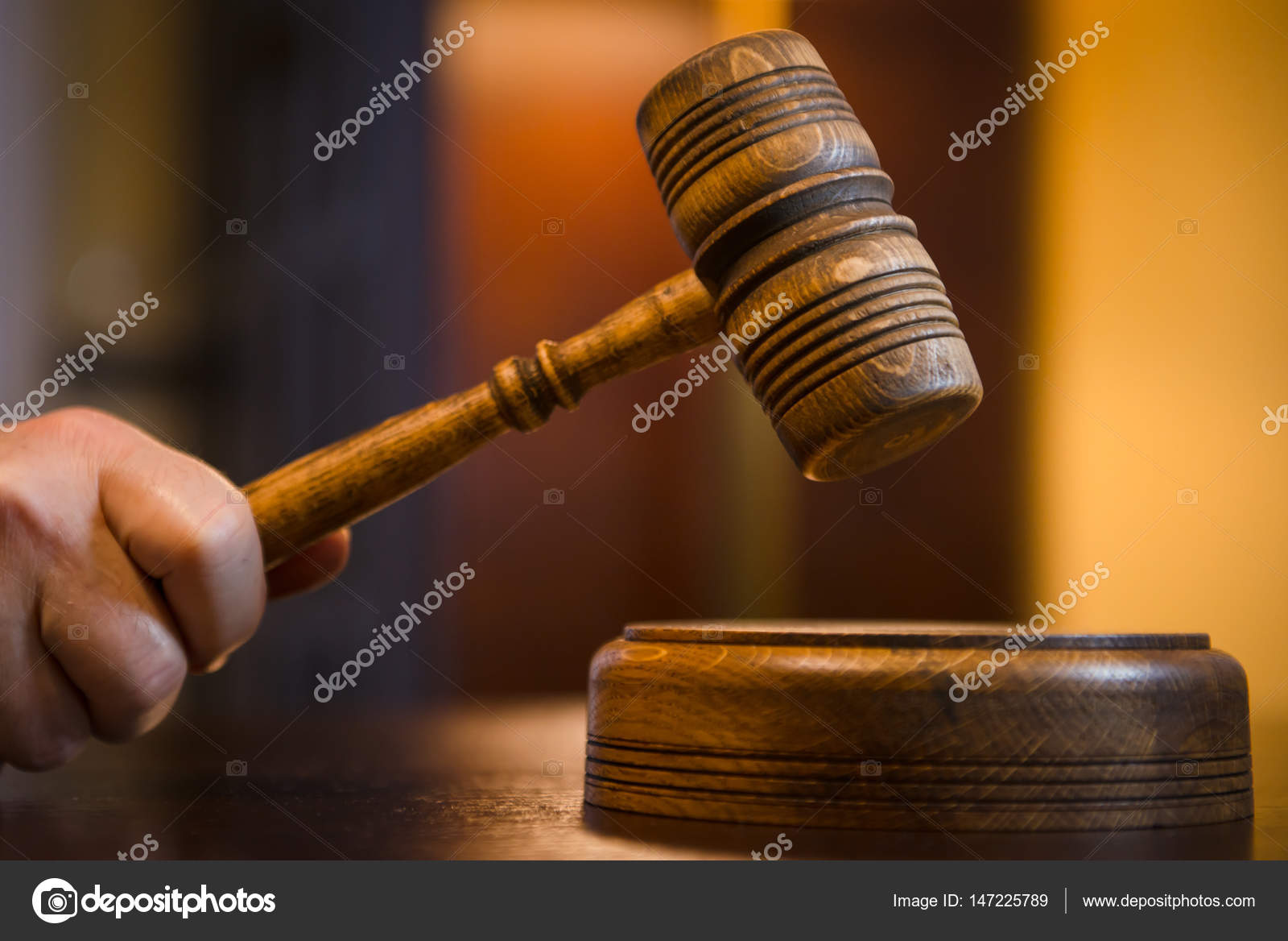 Judges mallet with justice scales and books on wooden rustic table