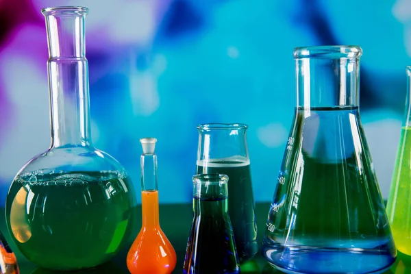 Laboratory equipment, lots of glass filled with colorful liquids — Stock Photo, Image