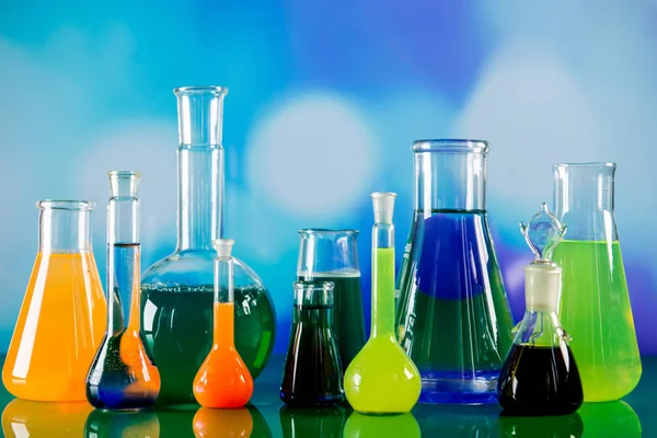 Laboratory equipment, lots of glass filled with colorful liquids — Stock Photo, Image