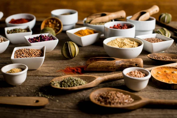 Various colorful spices on wooden table. Place for typography and logo — Stock Photo, Image