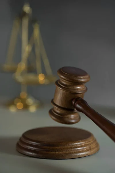 Still life of Law and Justice symbols  - gavel and scales on wooden table background.