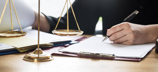 close up view of judge at workplace with hammer on table, jurisprudence concept 