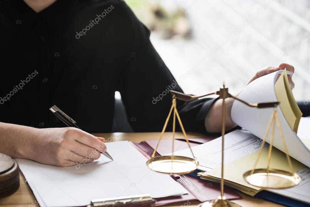 close up view of judge at workplace with hammer on table, jurisprudence concept 