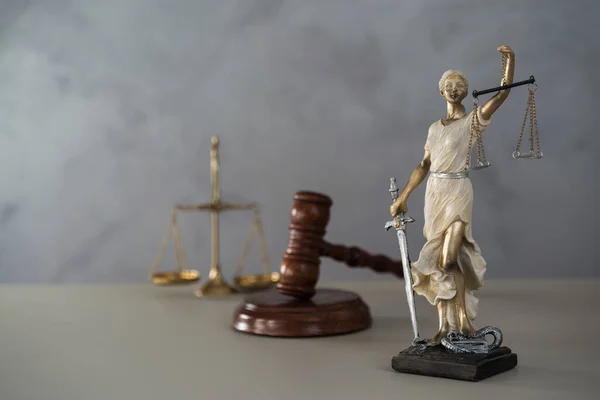 Statue of Justice with libra, court and law theme background
