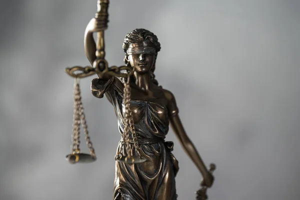 Statue of Justice with libra, court and law theme background