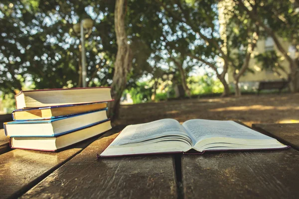 Pile of books outside.