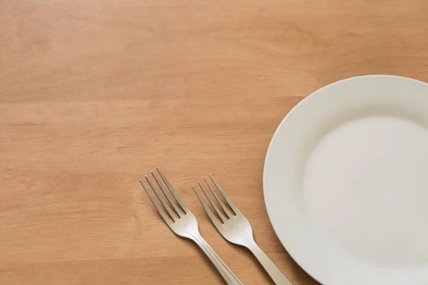 White plate with forks — Stock Photo, Image